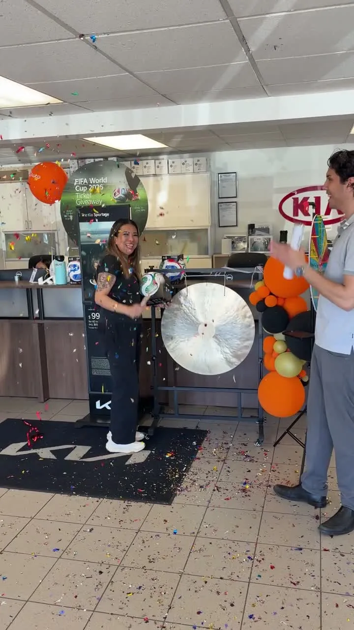 A customer rings the delivery gong under falling confetti